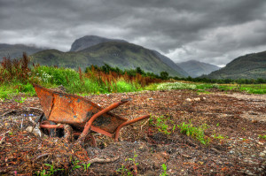 Rusty wheelbarrow at low tide